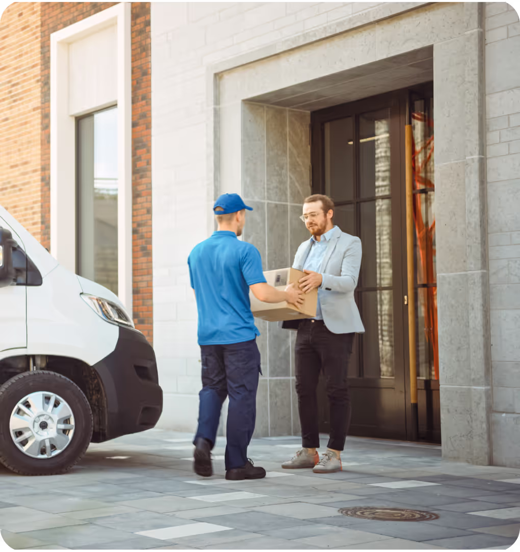 Delivery driver handing over package